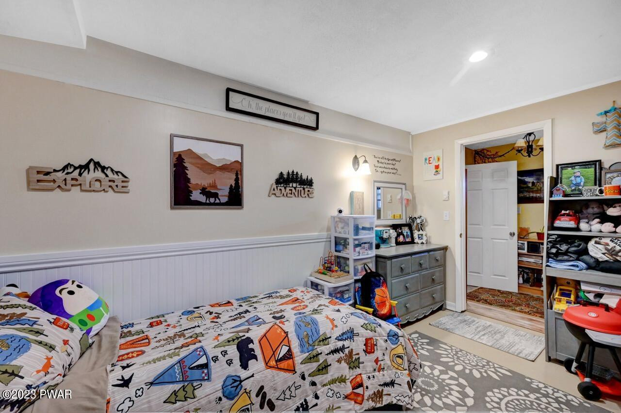 1597 Ridgeview Drive Lake Ariel, PA 18436 - Photo 50 of 92 a bed room with a bed and a book shelf