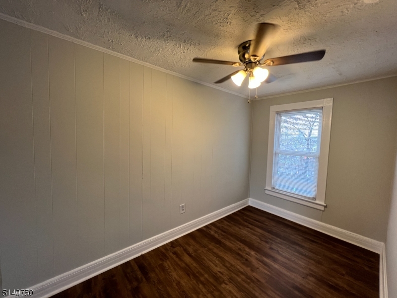 193 Forest Street, Unit 1 Montclair, NJ 07042 - Photo 11 of 20 an empty room with windows and fan