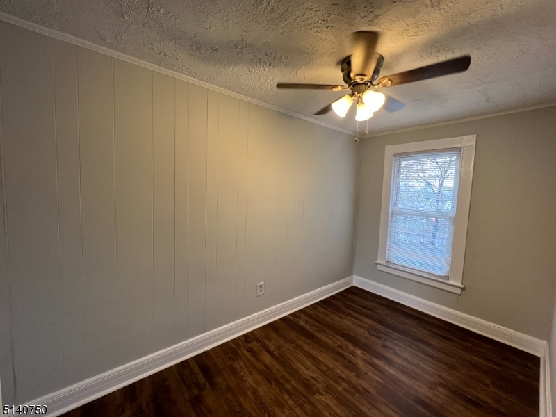 193 Forest Street, Unit 1 Montclair, NJ 07042 - Photo 12 of 20 a view of an empty room with wooden floor and a window