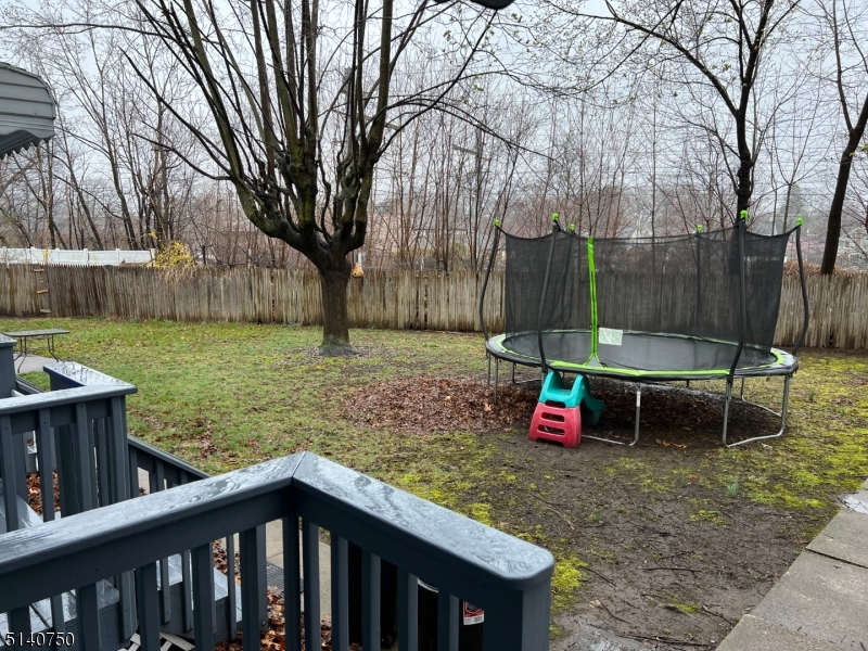 193 Forest Street, Unit 1 Montclair, NJ 07042 - Photo 19 of 20 a view of backyard with green space and trampoline