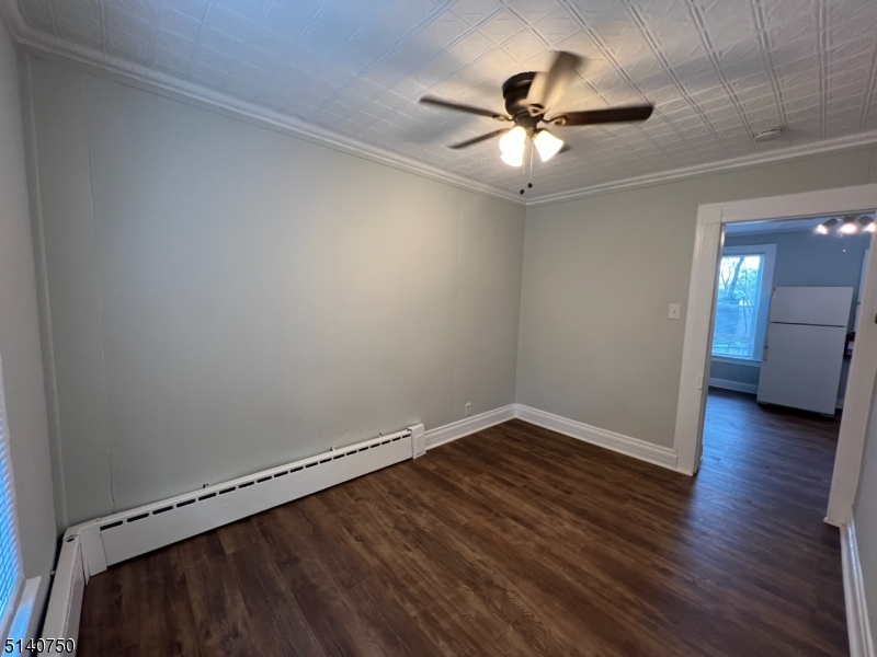 193 Forest Street, Unit 1 Montclair, NJ 07042 - Photo 4 of 20 wooden floor in an empty room with a window