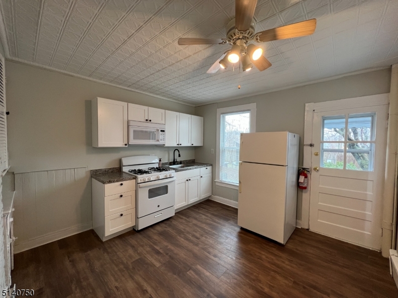 193 Forest Street, Unit 1 Montclair, NJ 07042 - Photo 7 of 20 a kitchen with a refrigerator and a stove top oven