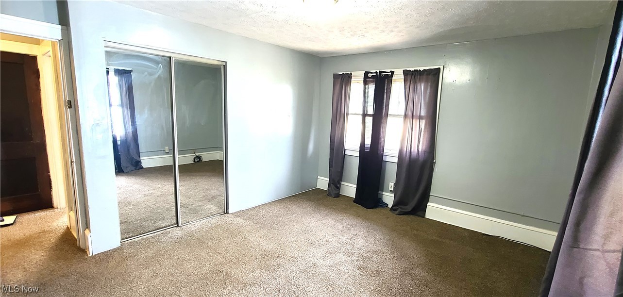 3210 Dryden Court Southwest Canton, OH 44708 - Photo 15 of 24 Master Bedroom with double cedar closet and carpet