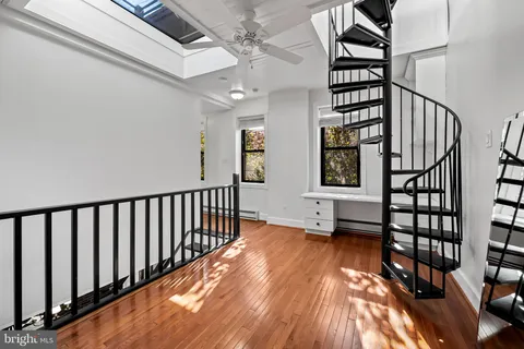a view of an entryway with wooden floor