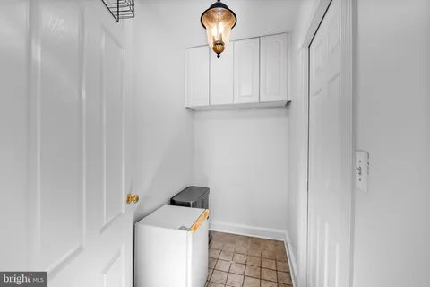 a view of a storage and utility room with a window