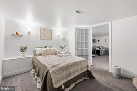 a bedroom with a bed and walk in closet