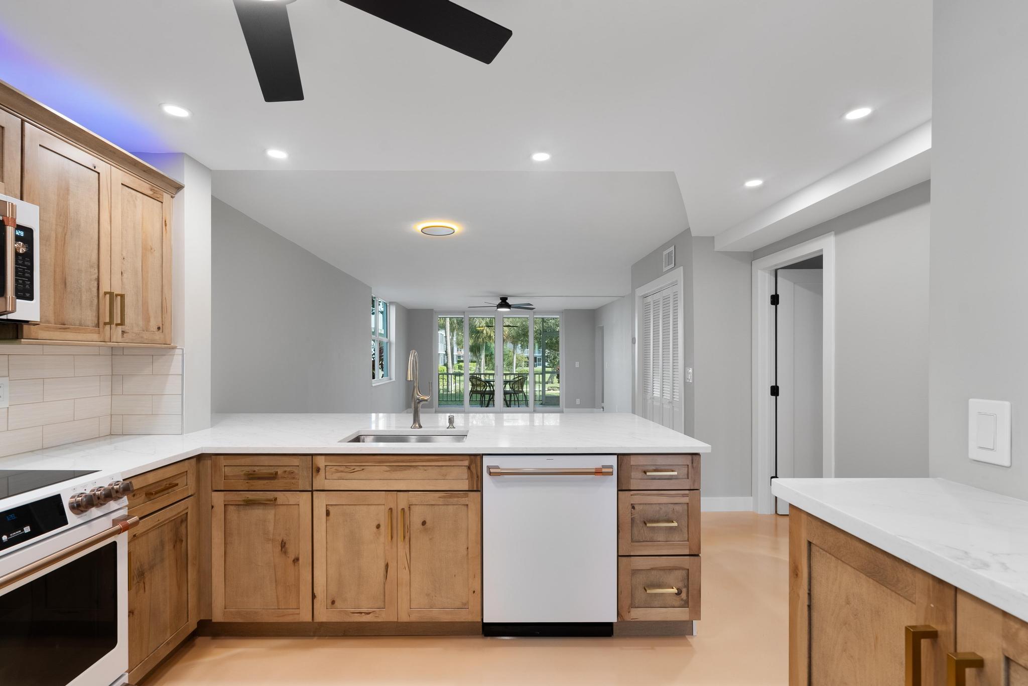2525 Florida Boulevard, Unit 127 Delray Beach, FL 33483 - Photo 11 of 62 a kitchen with a stove and a sink