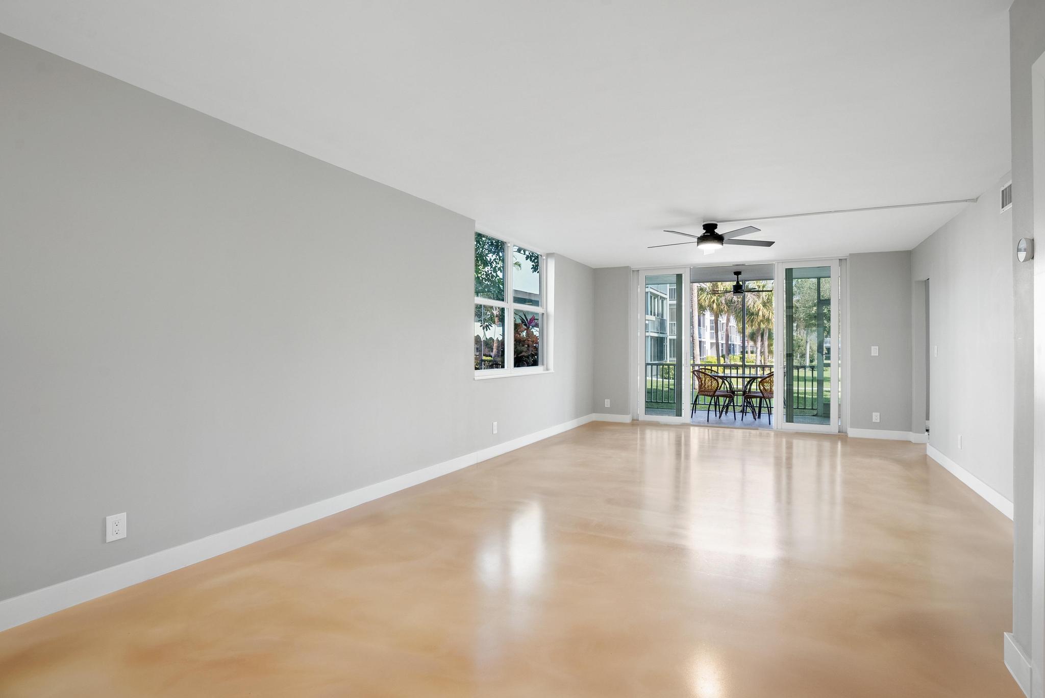2525 Florida Boulevard, Unit 127 Delray Beach, FL 33483 - Photo 16 of 62 wooden floor in an empty room with a window