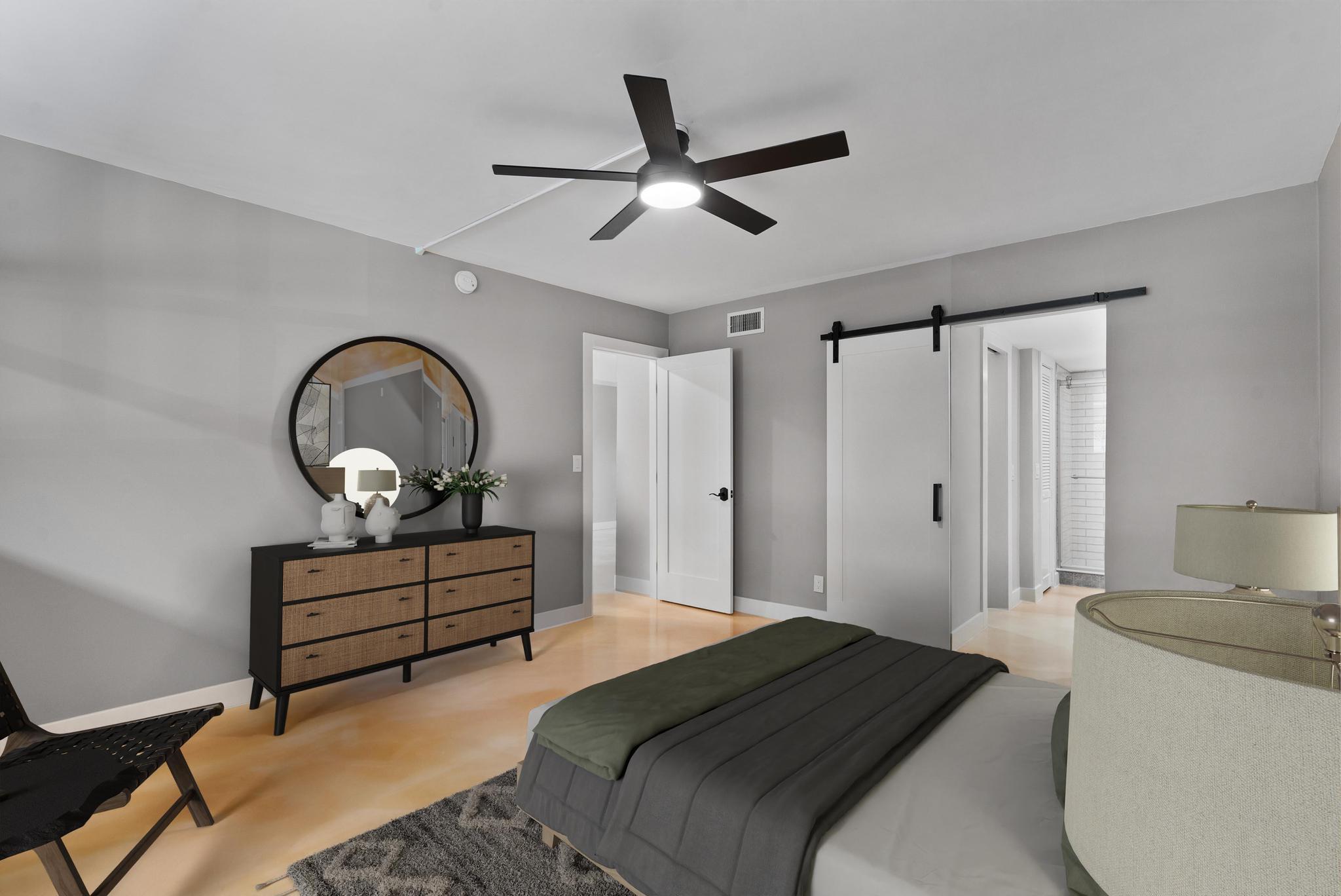 2525 Florida Boulevard, Unit 127 Delray Beach, FL 33483 - Photo 27 of 62 a bedroom with a bed and a chandelier