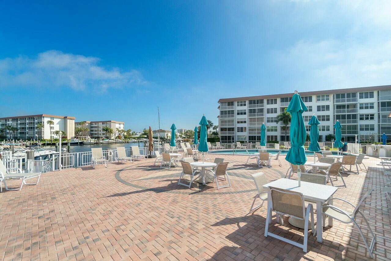 2525 Florida Boulevard, Unit 127 Delray Beach, FL 33483 - Photo 37 of 62 a view of pool table and chairs in patio