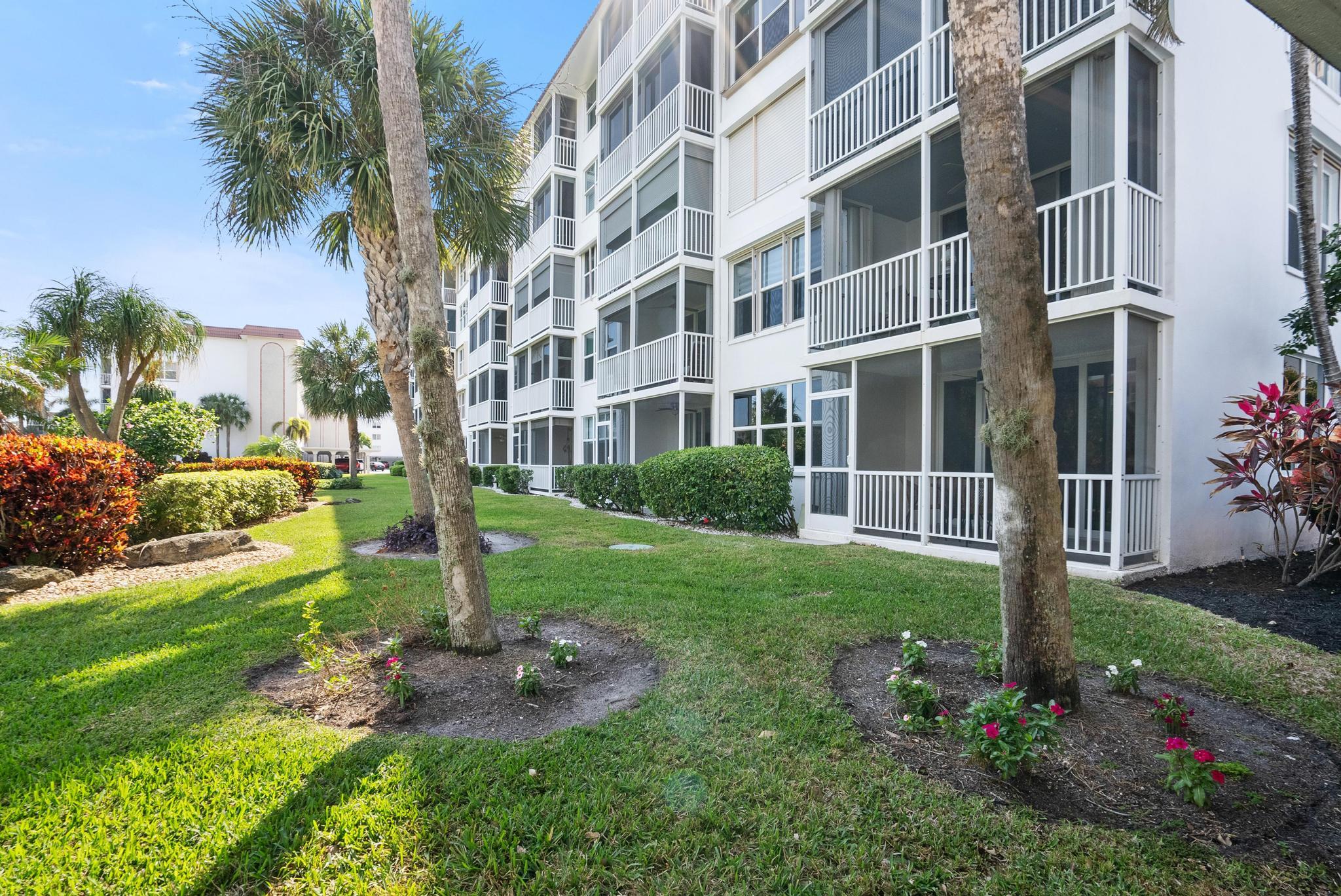 2525 Florida Boulevard, Unit 127 Delray Beach, FL 33483 - Photo 5 of 62 a view of a building with a yard