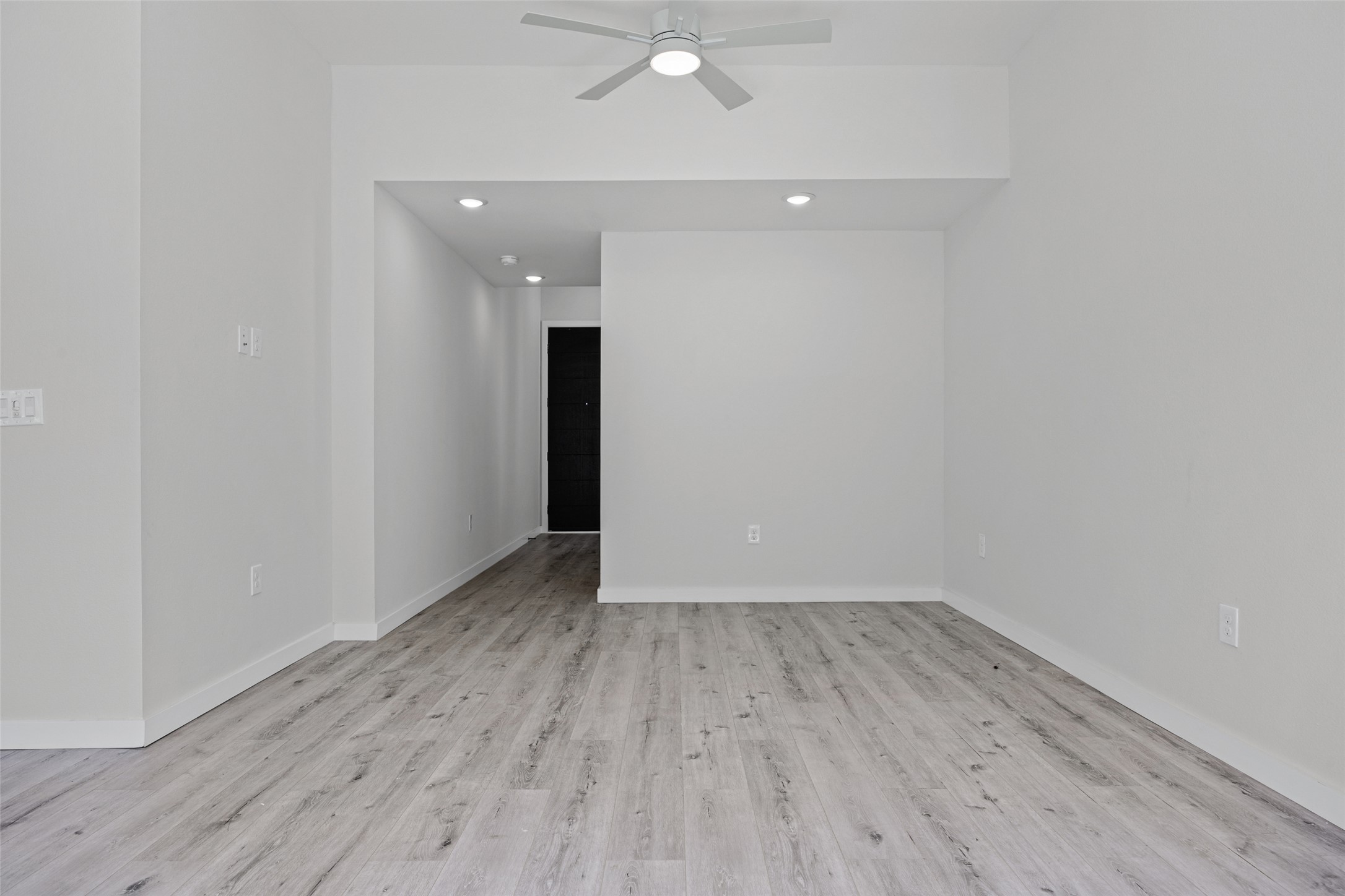 2000 Riverside Farms Road, Unit 5102 Austin, TX 78741 - Photo 6 of 25 A well-lit interior features light-toned flooring, recessed lighting, and a modern ceiling fan.
