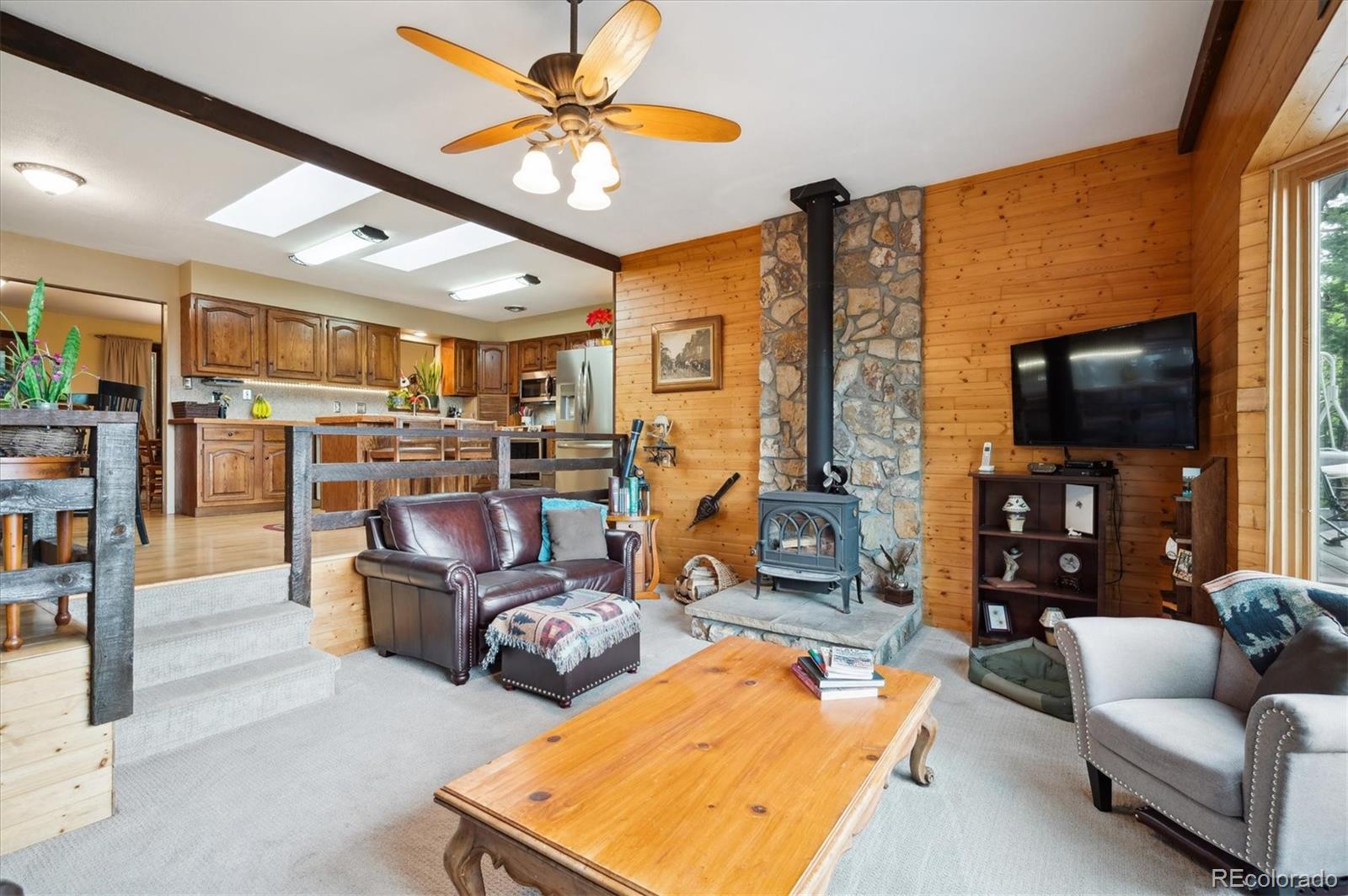 11094 Thomas Drive Conifer, CO 80433 - Photo 17 of 44 a view of a livingroom with furniture and a flat screen tv
