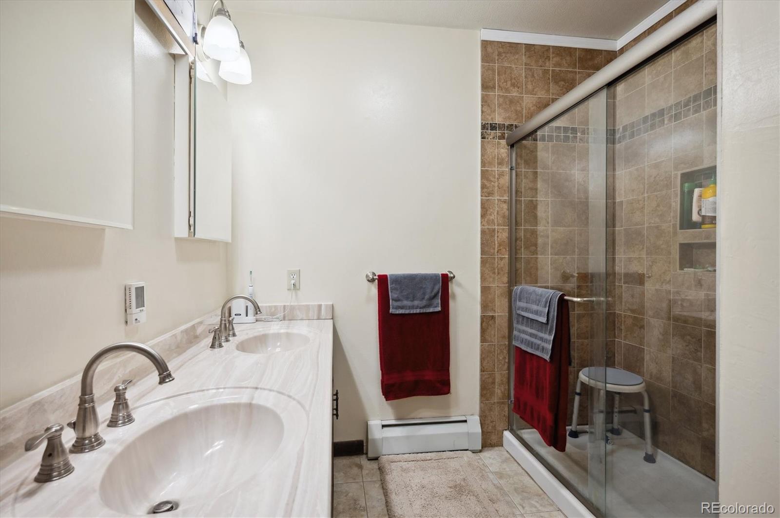 11094 Thomas Drive Conifer, CO 80433 - Photo 20 of 44 a bathroom with a sink and a mirror