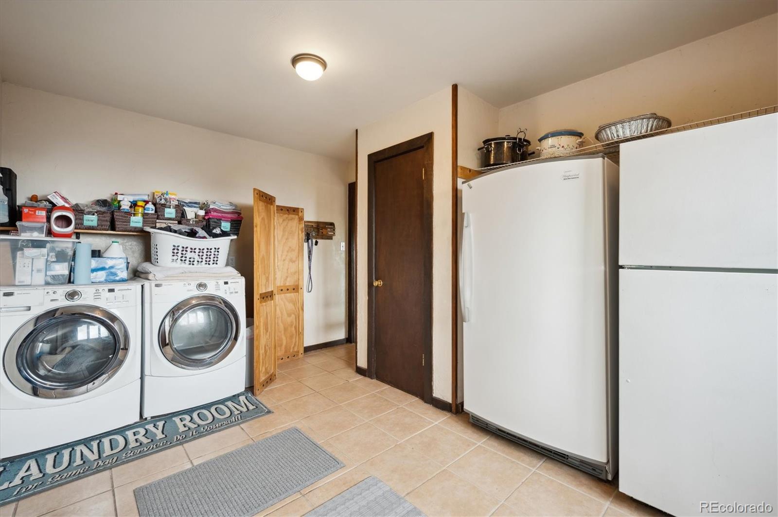 11094 Thomas Drive Conifer, CO 80433 - Photo 24 of 44 a utility room with dryer and washer