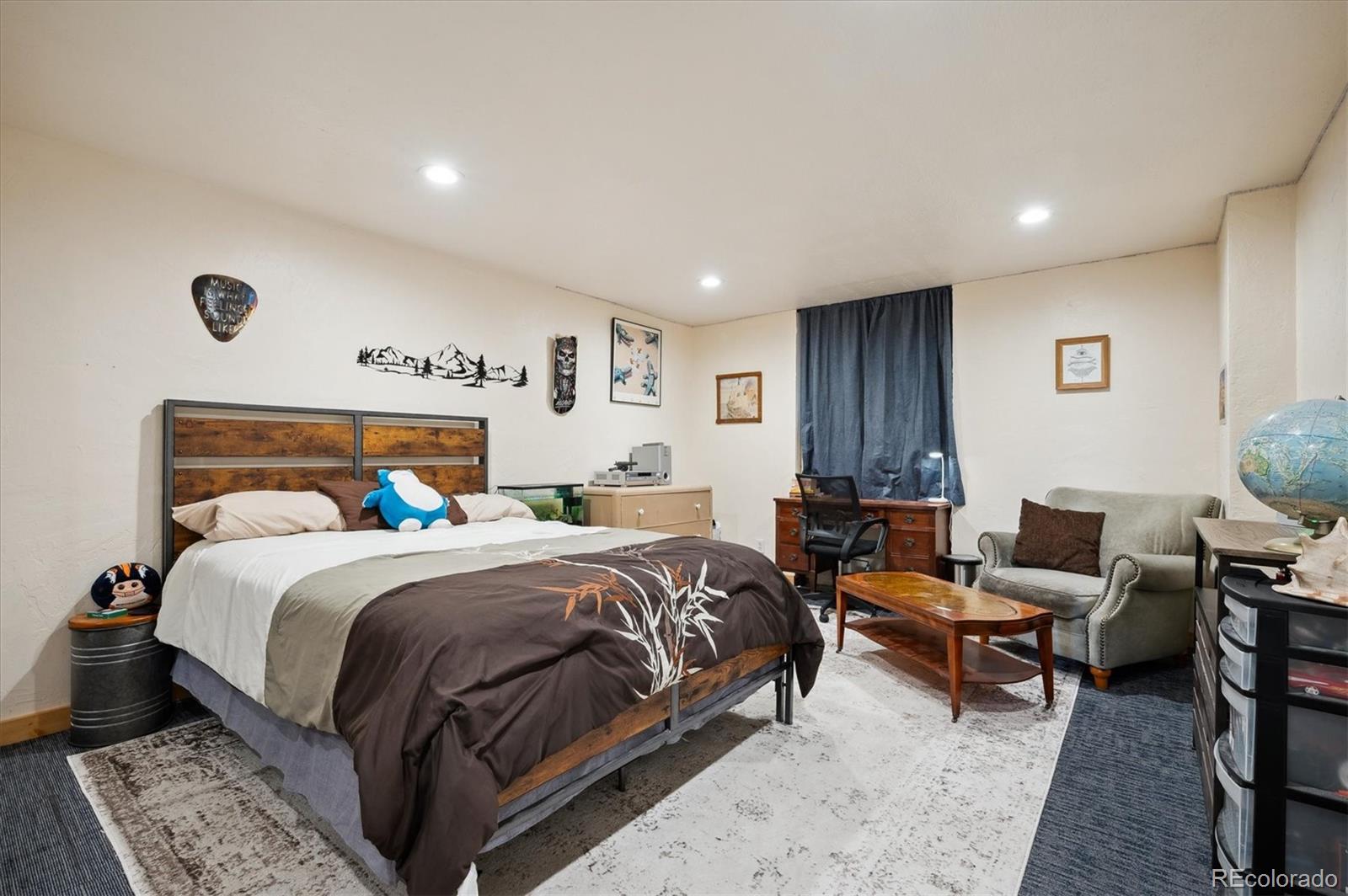 11094 Thomas Drive Conifer, CO 80433 - Photo 26 of 44 a bedroom with bed and a window