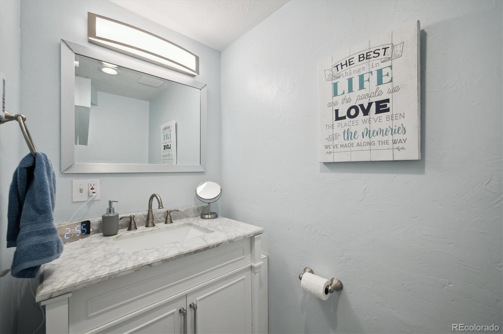 11094 Thomas Drive Conifer, CO 80433 - Photo 29 of 44 a bathroom with a sink and a mirror