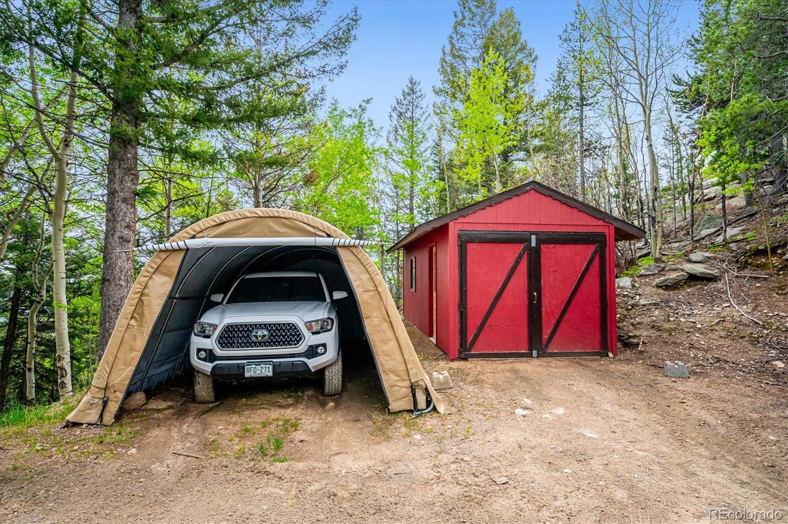 11094 Thomas Drive Conifer, CO 80433 - Photo 42 of 44 a view of a car parked in a yard