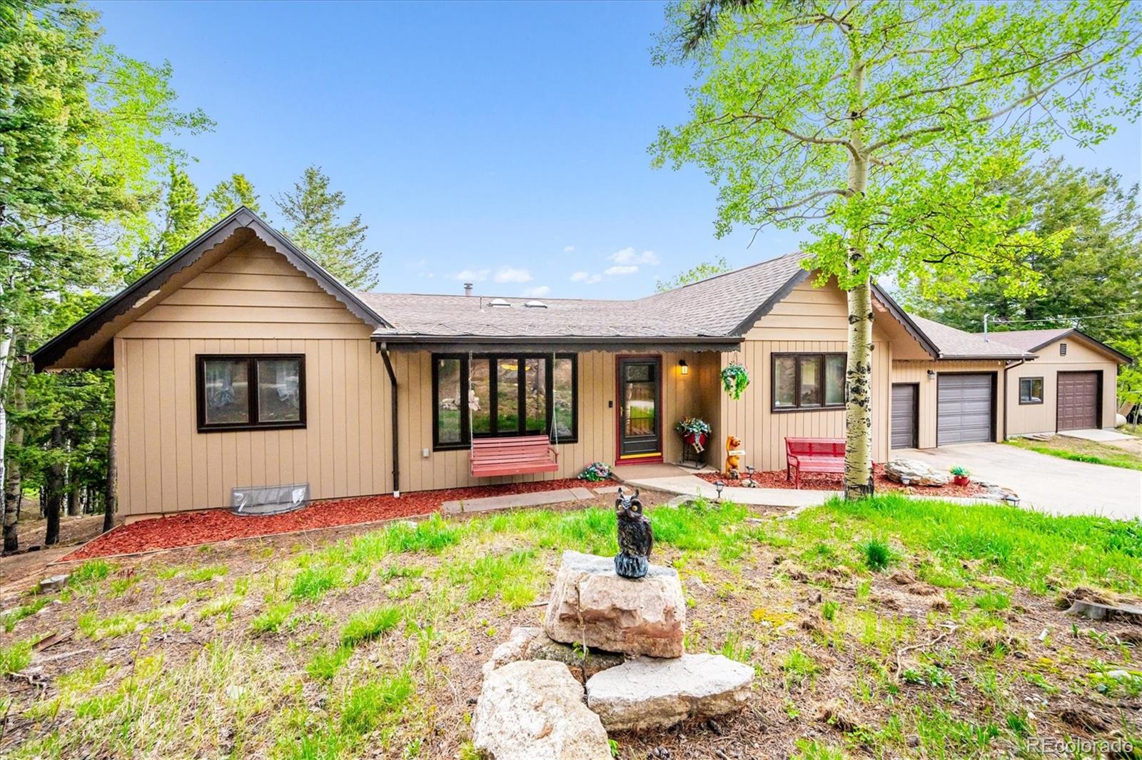 11094 Thomas Drive Conifer, CO 80433 - Photo 5 of 44 a front view of house with yard and green space