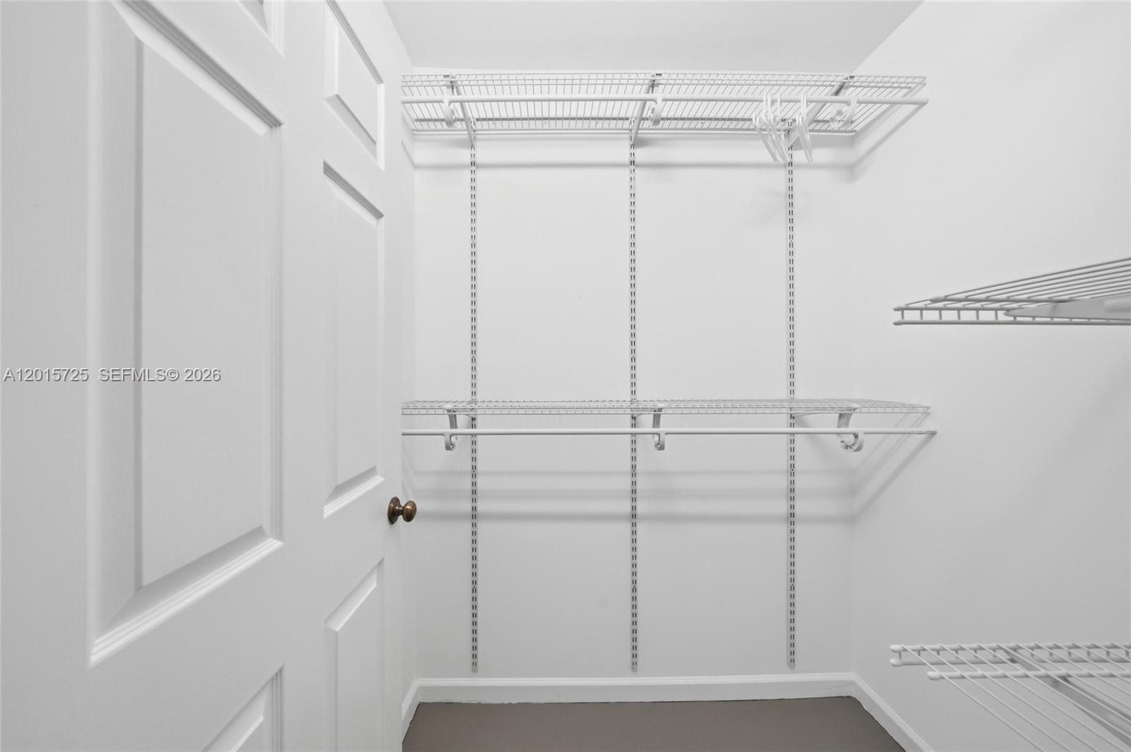 11008 Boca Woods Lane Boca Raton, FL 33428 - Photo 22 of 70 a view of a room with racks on the wall
