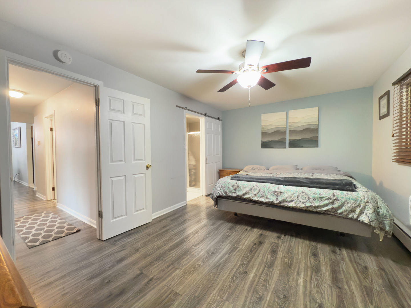 1313 Rebecca Road, Unit 118 Lombard, IL 60148 - Photo 14 of 19 a spacious bedroom with a bed and wooden floor