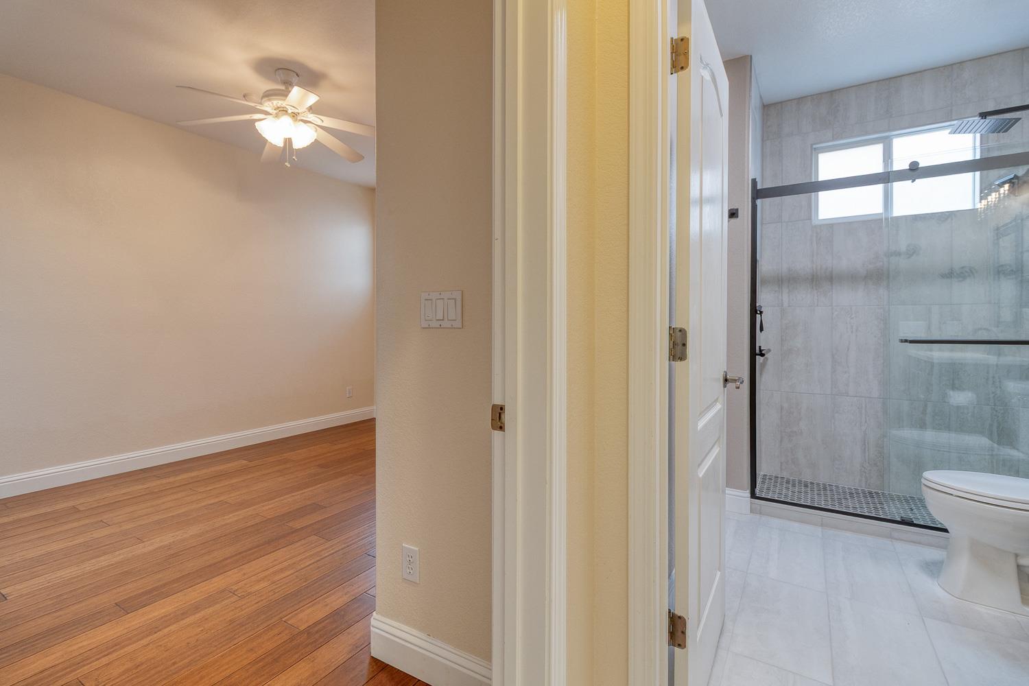 2833 Winged Foot Way Modesto, CA 95355 - Photo 6 of 38 Downstairs bedroom and full bathroom off left of entryway.