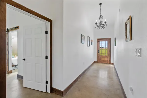 a view of an entryway with wooden floor