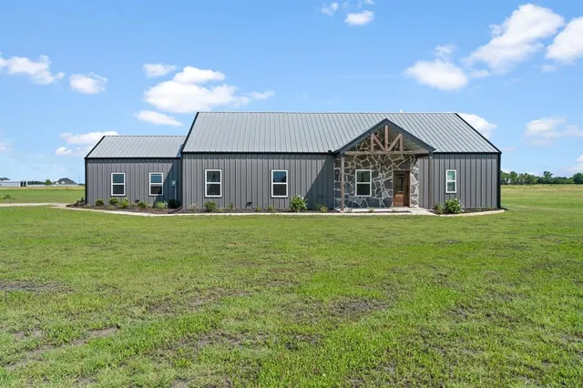 a front view of house with garden