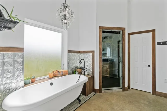 a bathroom with a tub and a sink
