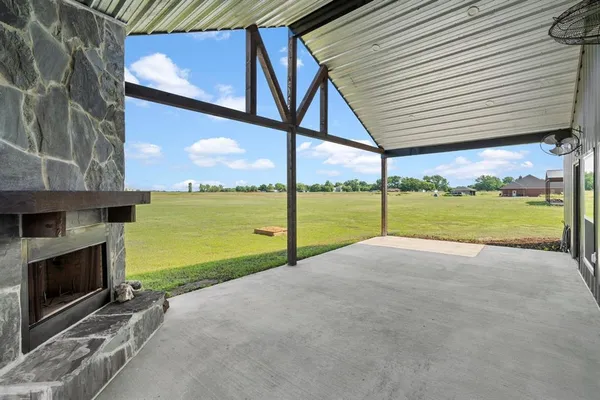 a view of a house with an outdoor space and seating area