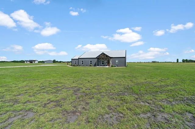 a view of a big room with table and chairs