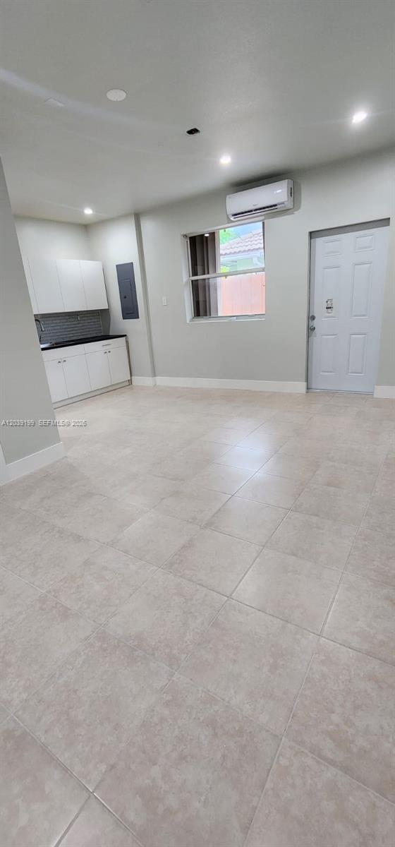 14817 Southwest 180th Street Miami, FL 33187 - Photo 12 of 15 an empty room with a empty space and windows