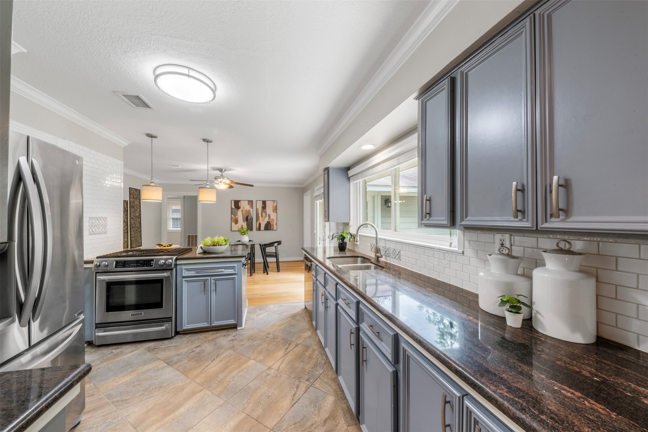 4307 Spellman Road Houston, TX 77035 - Photo 14 of 31 Sleek granite countertops, rich colors, and natural light give this home a cozy yet luxurious feel.