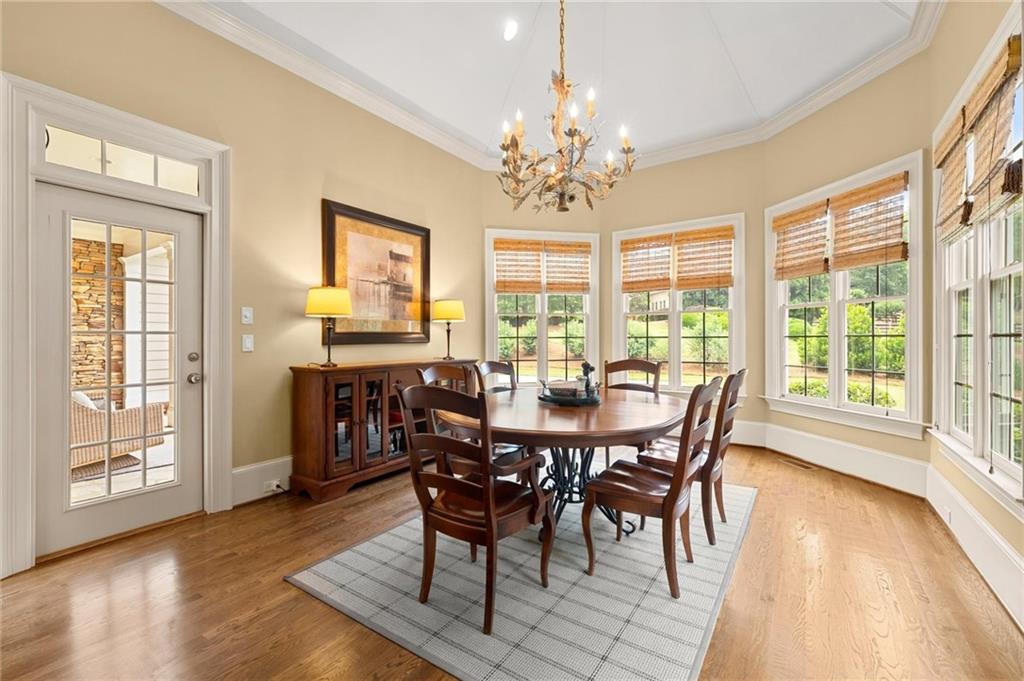 322 Edwards Brook Lane Canton, GA 30115 - Photo 32 of 99 a view of a dining room with furniture wooden floor and chandelier