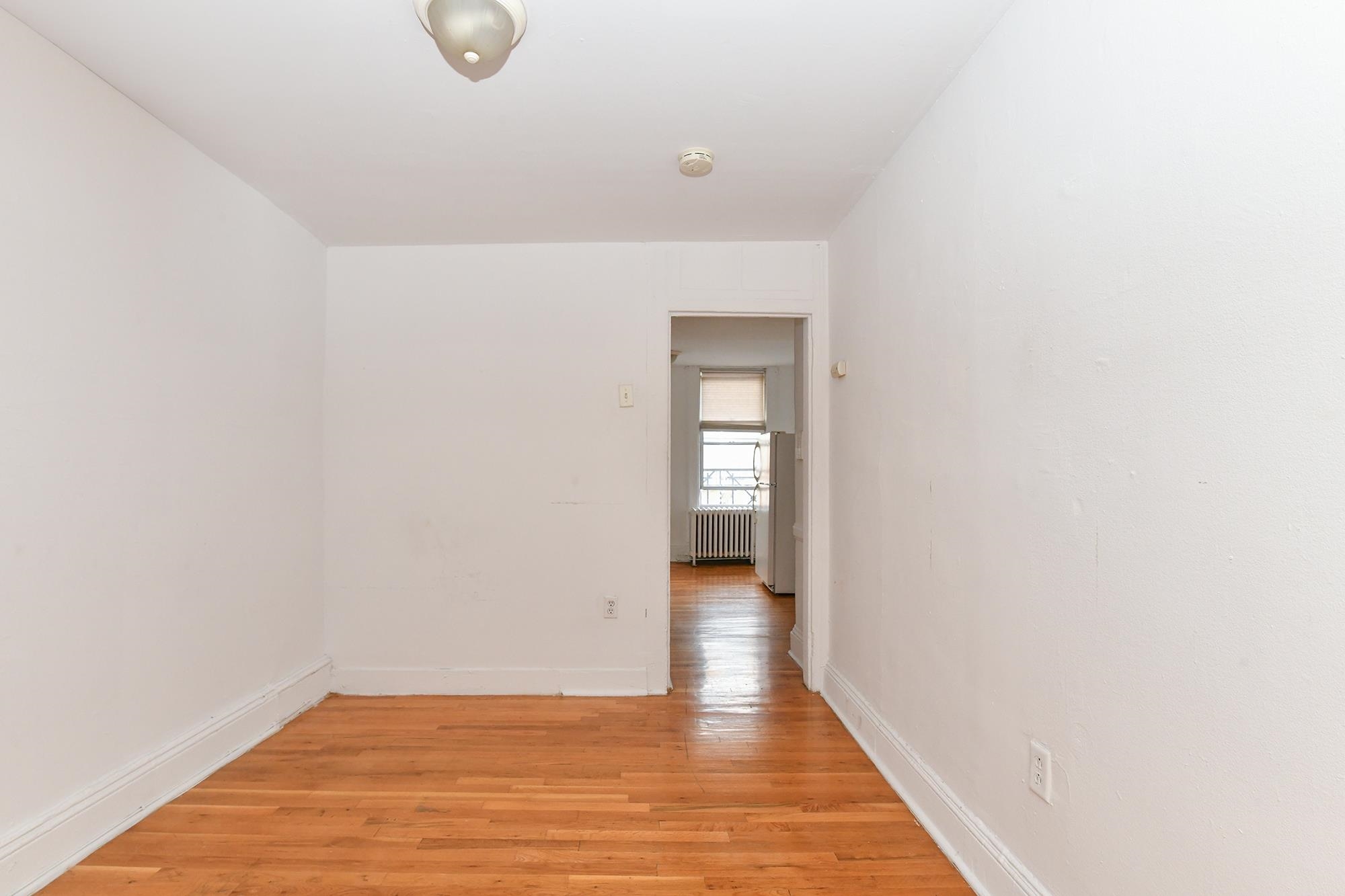 409 Bloomfield Street, Unit 7 Hoboken, NJ 07030 - Photo 4 of 14 a view of a room with wooden floor