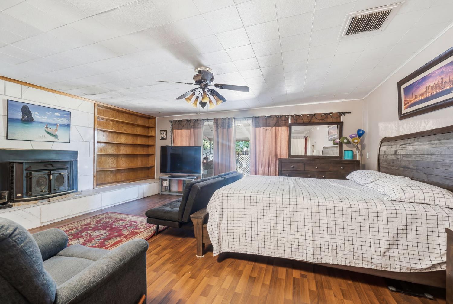 1705 Stetson Avenue Modesto, CA 95350 - Photo 20 of 32 a bedroom with a bed and wooden floor