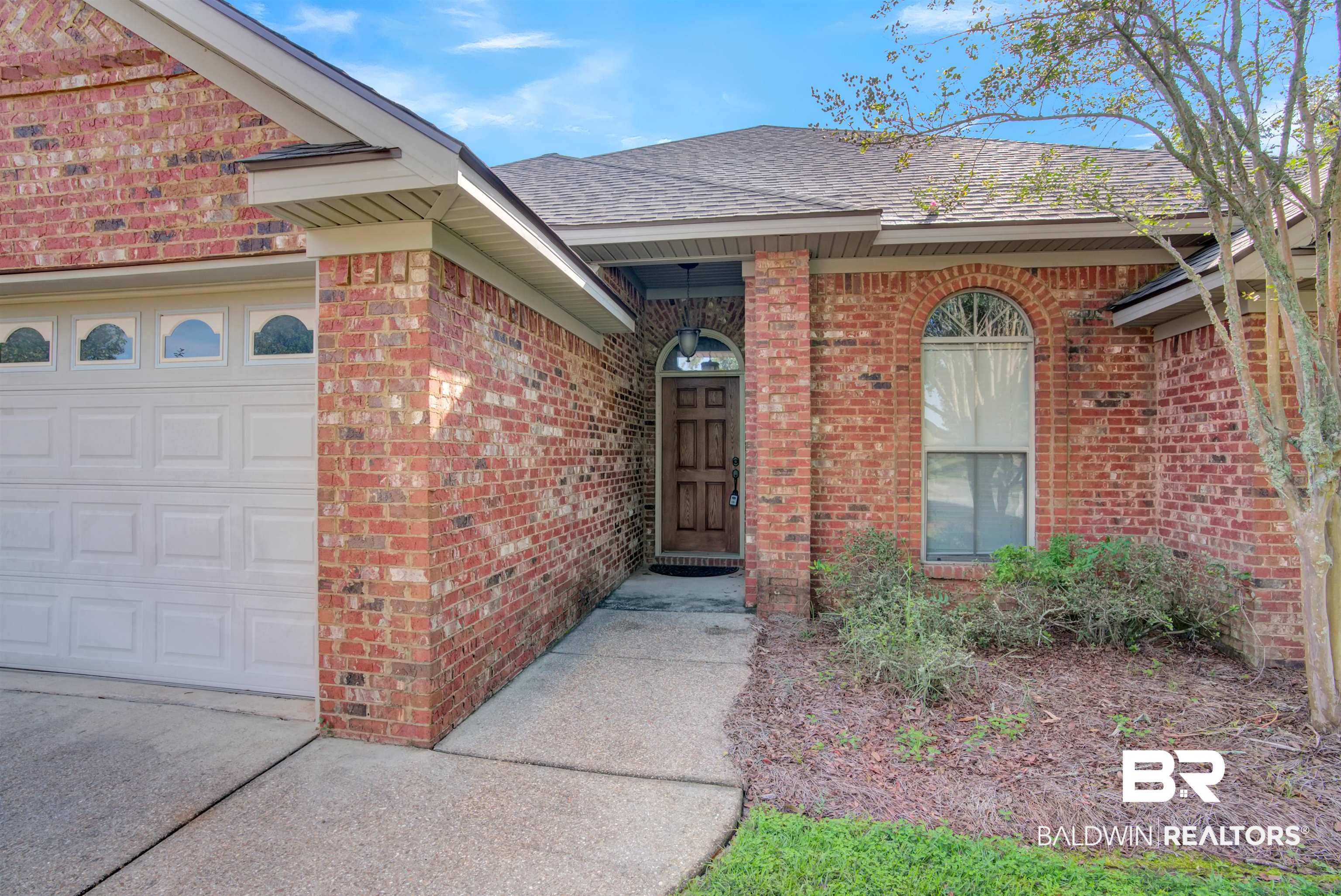 9532 Collier Loop Daphne, AL 36526 - Photo 37 of 45 View of exterior entry featuring a garage