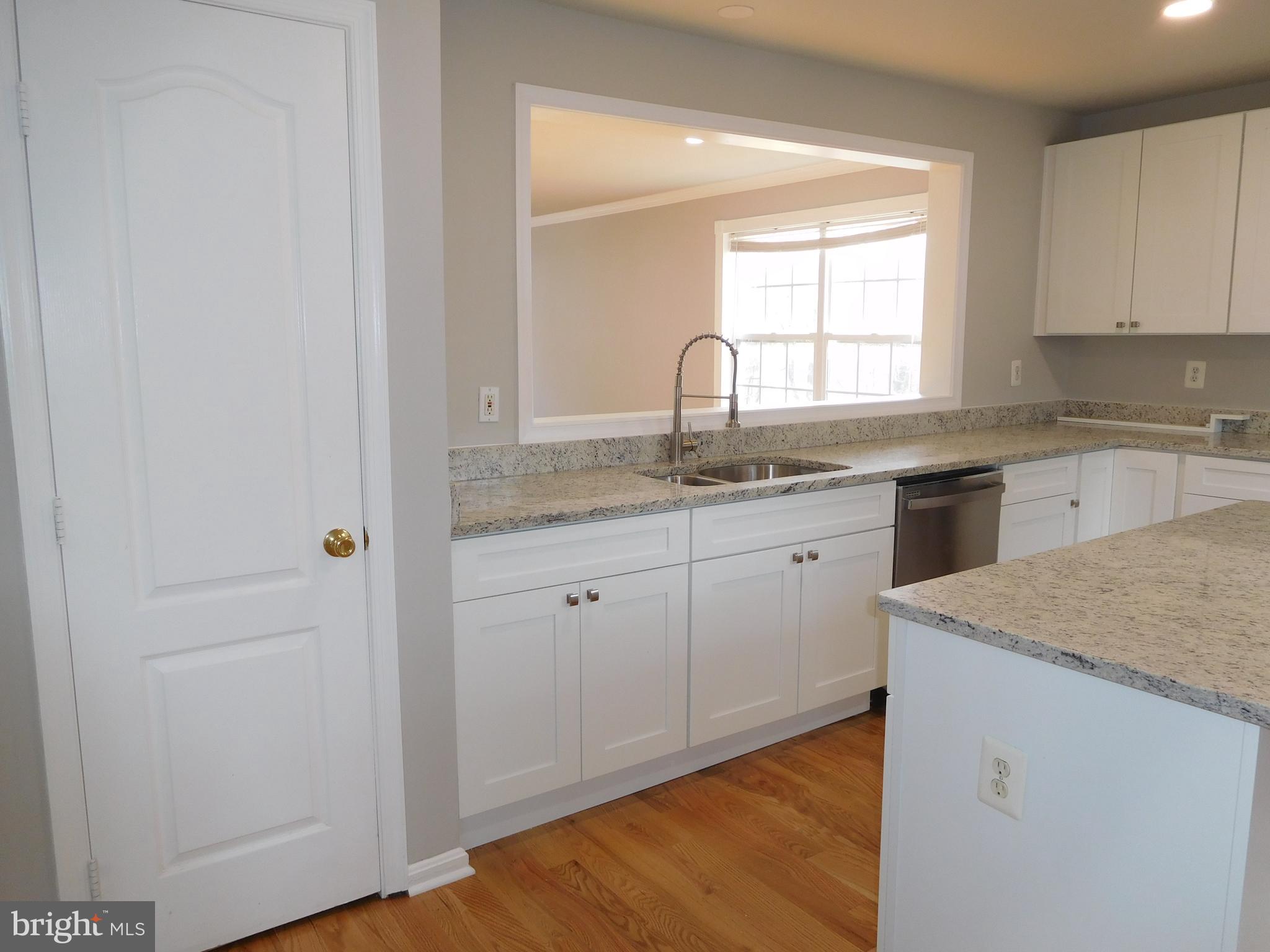 9900 Doubletree Lane Bowie, MD 20721 - Photo 3 of 18 a kitchen with a sink cabinets and window