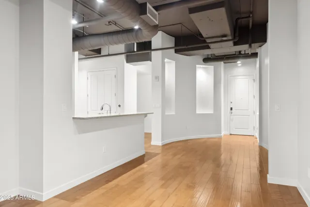 a kitchen with stainless steel appliances granite countertop a refrigerator and a stove