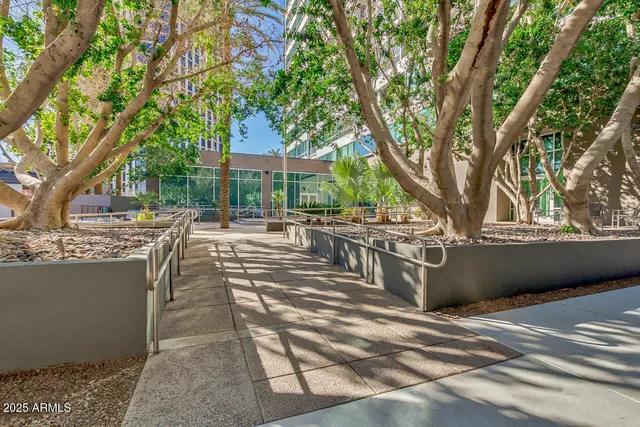 a living room with lots of furniture and a large mirror