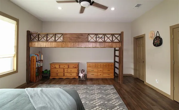 a bedroom with a bed and window