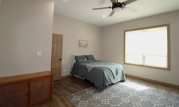 a bedroom with a bed and window
