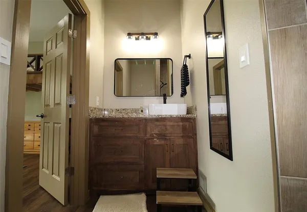 a bathroom with a sink and a mirror
