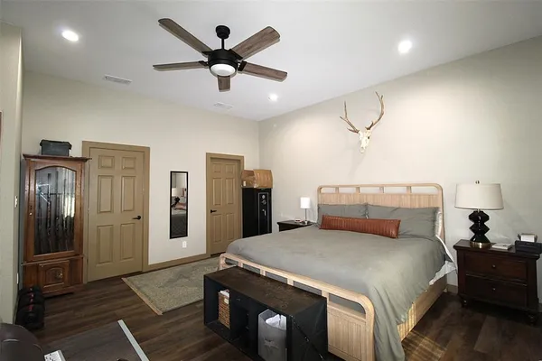 a bed room with a bed and a chandelier