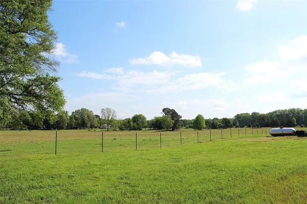 a view of a field with a small yard