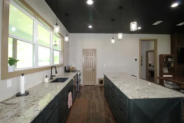 a bathroom with double vanity and a granite counter tops