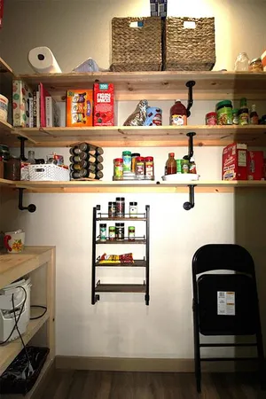 a cabinet with stainless steel appliances and cabinets
