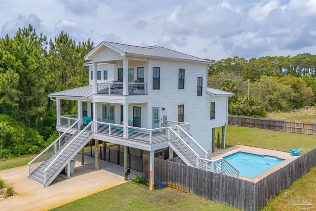 a balcony with table and chairs