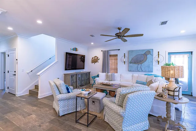 a view of a dining room with furniture wooden floor and chandelier