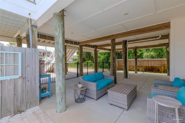 a bedroom with a bed and painting on the wall